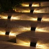 Lampy solarne LED (4 szt.) w kolorze czarnym - 10,9 x 6,3 cm